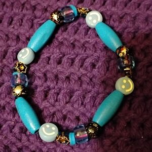 Blue Beaded Bracelet with Smiley Faces